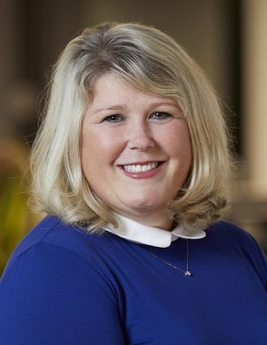 Deb LaMere Chief Human Resources Officer at Datasite seen in a white and bright blue color outfit